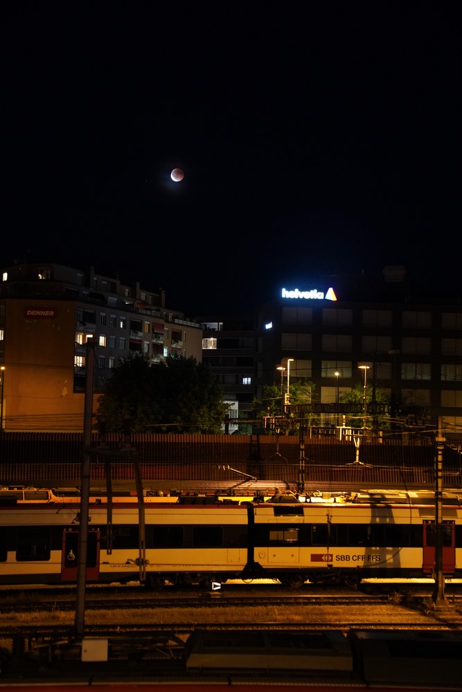 Total lunar eclipse blood moon over Lucerne train station