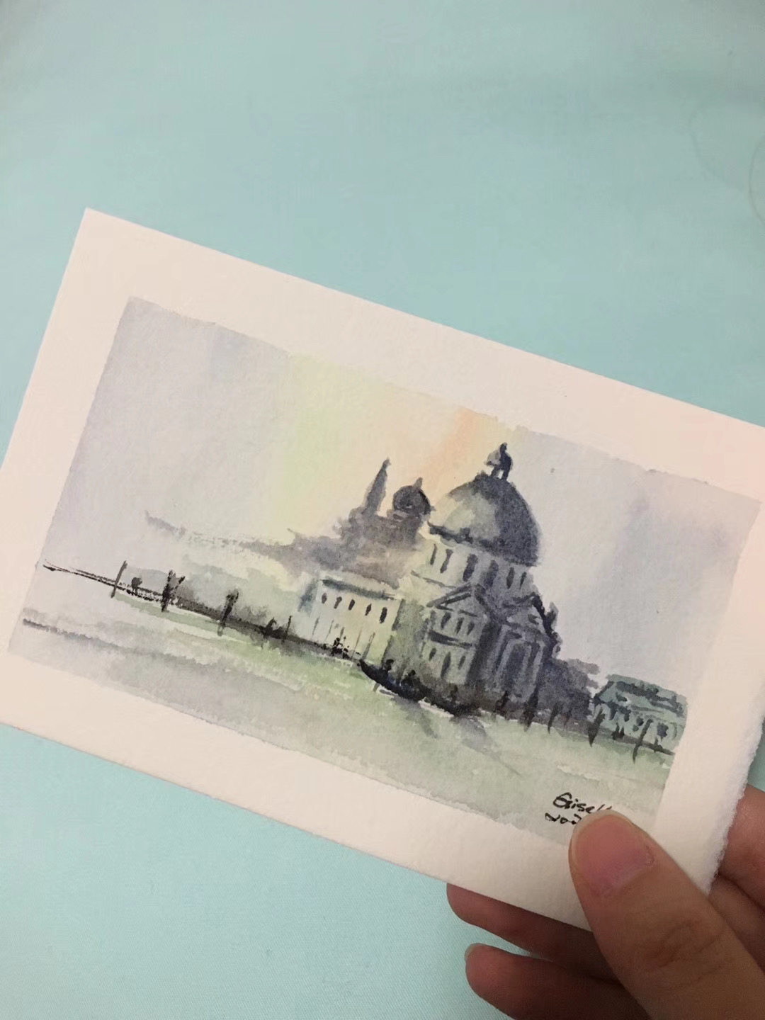 A small watercolor painting of Venice held in hand, 2017